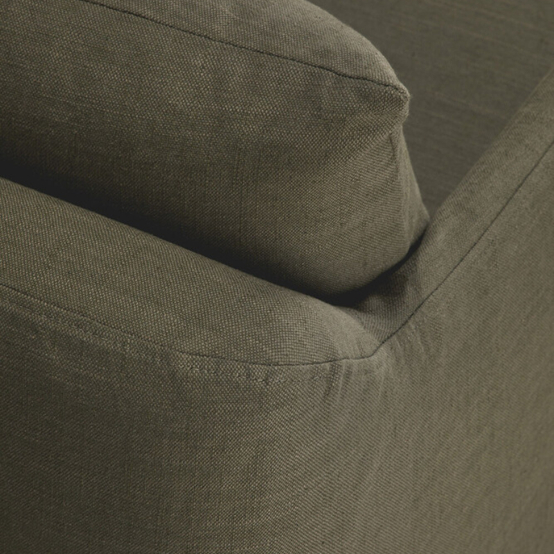 The Weave Lounge Chair by Ethnicraft in green with texture details.