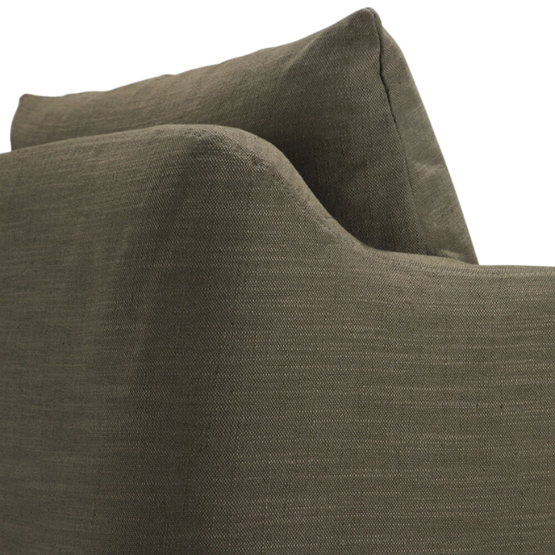 The Weave Lounge Chair by Ethnicraft in green from the back corner edge.