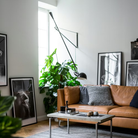 The black 265 Wall Lamp from Flos in a family area.