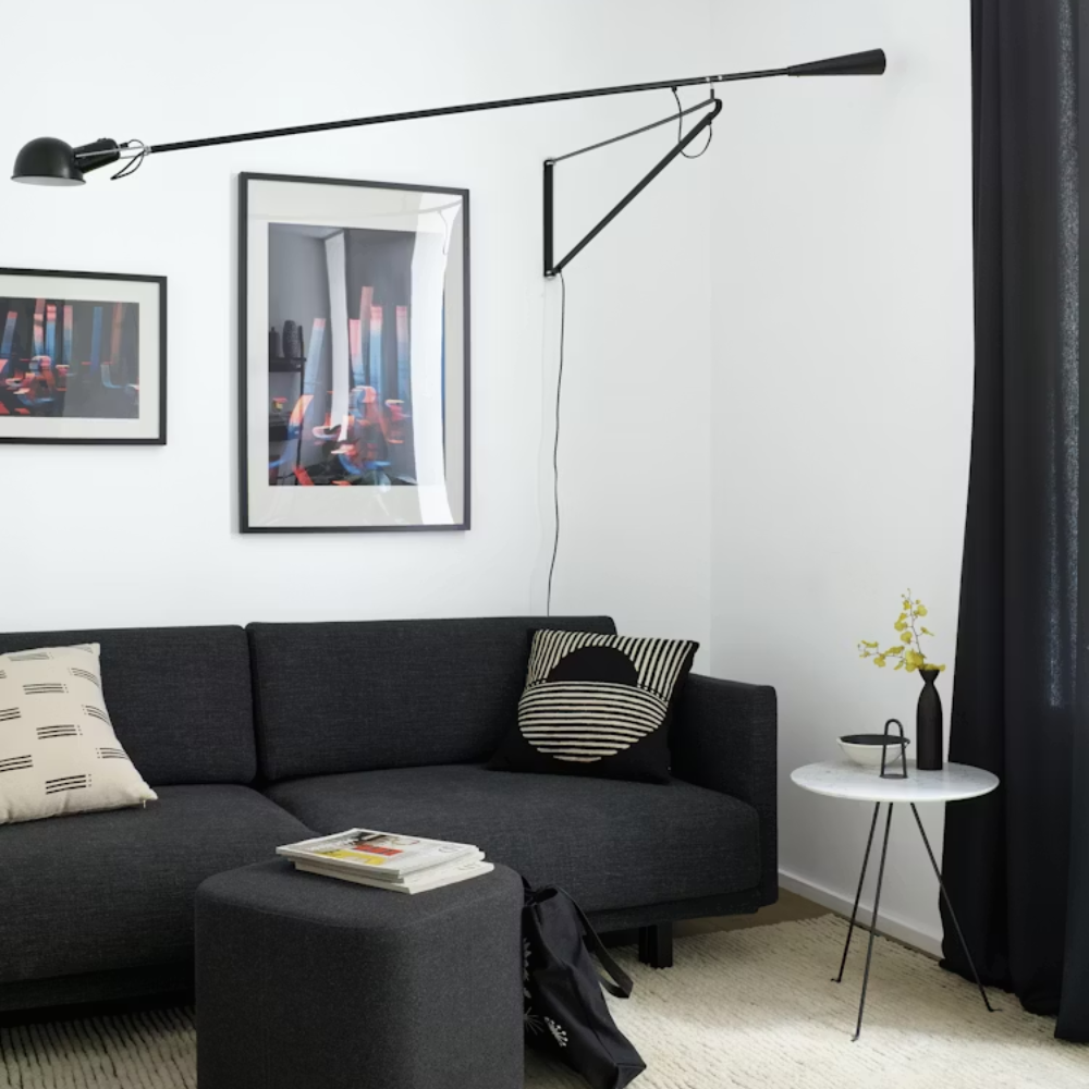 The black 265 Wall Lamp from Flos in a living space.
