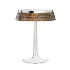 The Bon Jour Table Lamp from Flos in chrome with fumee crown.