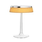 The Bon Jour Table Lamp from Flos in chrome with plisse cloth crown.