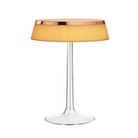 The Bon Jour Table Lamp from Flos in copper with plisse cloth crown.