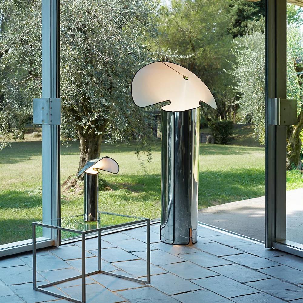 The Chiara Floor Lamp by Flos in a sunroom.