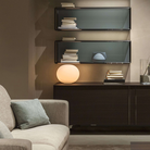 The 13 inch Glo-Ball Basic Table Lamp from Flos in a lounge.