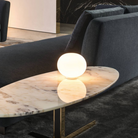 The Glo-Ball Basic Zero Table Lamp from Flos in a family space.