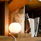 The Mini Glo-Ball Table Lamp from Flos in a living space.