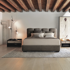 The Parentesi Lamp from Flos in Black in a bedroom.