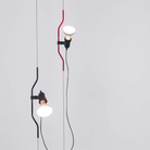 The Parentesi Lamp from Flos in Black and Red.