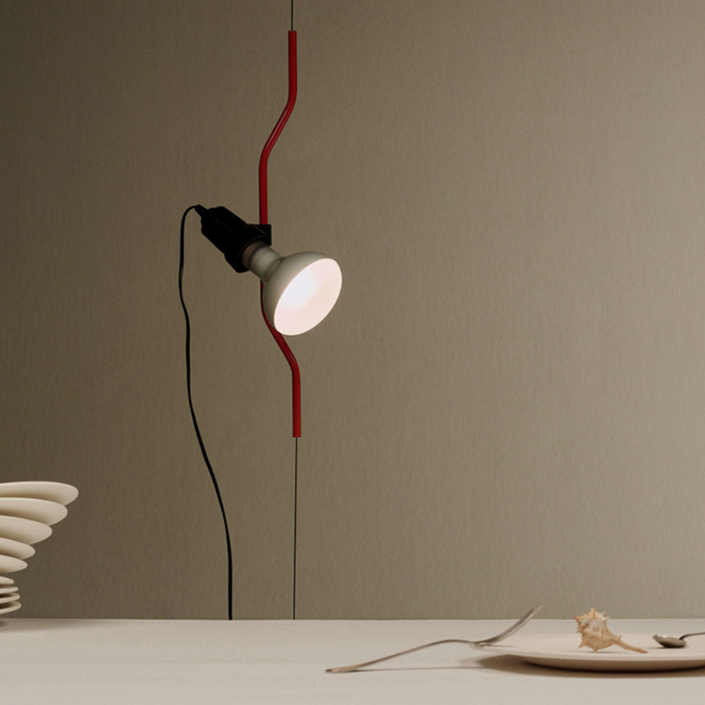 The Parentesi Lamp from Flos in Red up close.