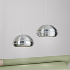 The Splugen Brau Suspension from Flos in a dining room.