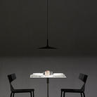 The Aplomb Large Pendant from Foscarini in anthracite in a living room.
