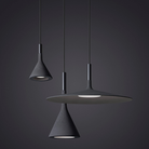 The Aplomb Large Pendant from Foscarini in anthracite in a living space.
