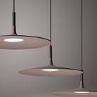 The Aplomb Large Pendant from Foscarini in brown in an office.