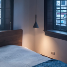 The Aplomb Pendant from Foscarini in anthracite in a family space.