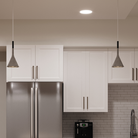 The Aplomb Pendant from Foscarini in concrete grey in a living room.