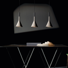 The Aplomb Pendant from Foscarini in concrete grey in a lounge.