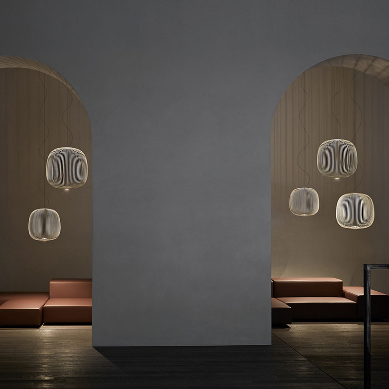 The Spokes 2 Pendant from Foscarini in small graphite in a bedroom.