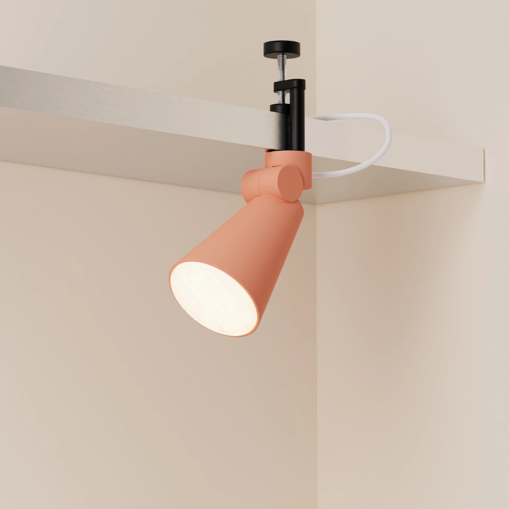 The blossom Aim Clamp Light from Gantri with the black clamp.