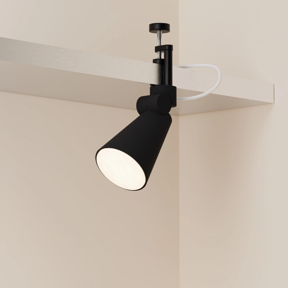 The carbon Aim Clamp Light from Gantri with the black clamp.