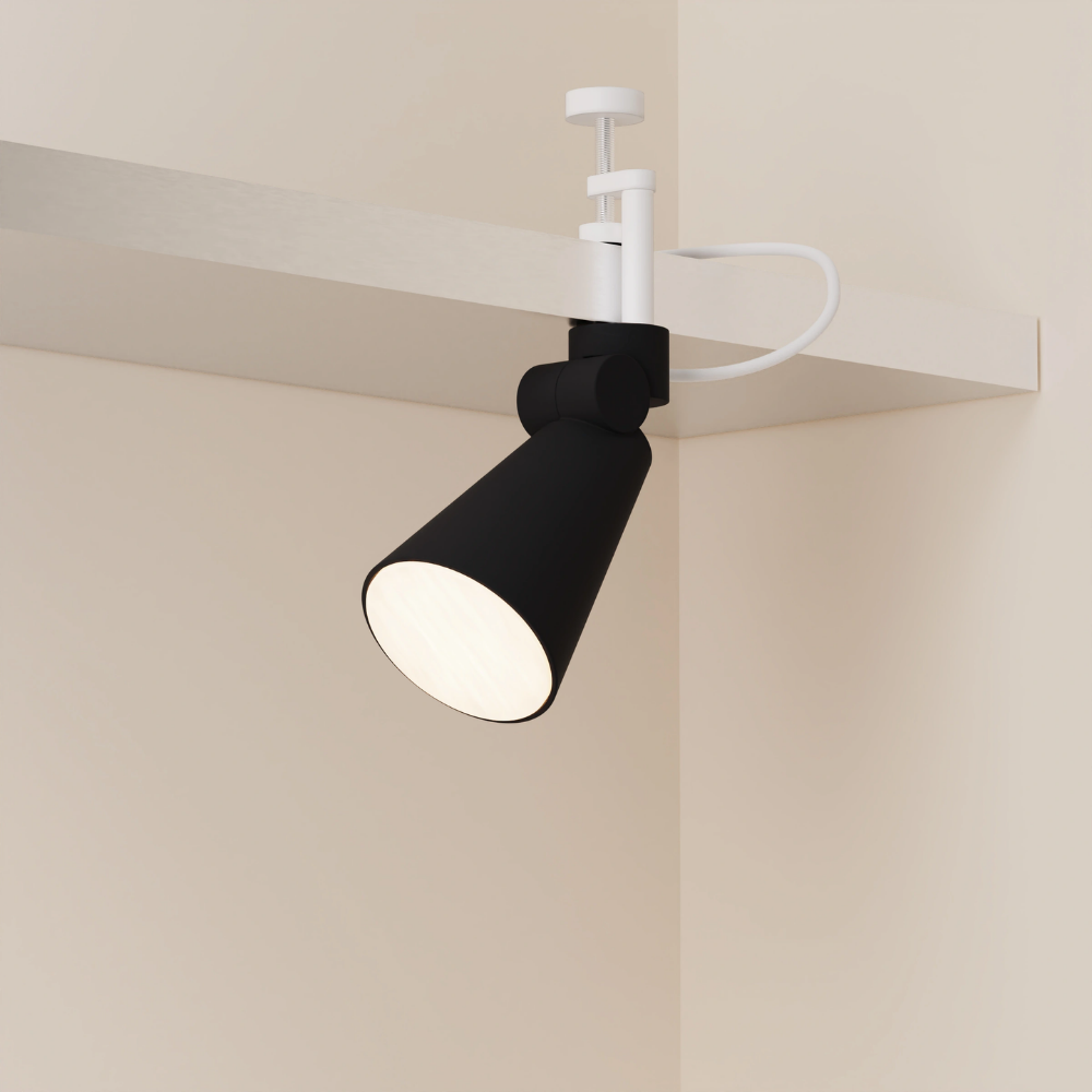 The carbon Aim Clamp Light from Gantri with the white clamp.