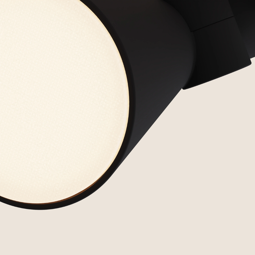 The carbon Aim Clamp Light from Gantri close up.