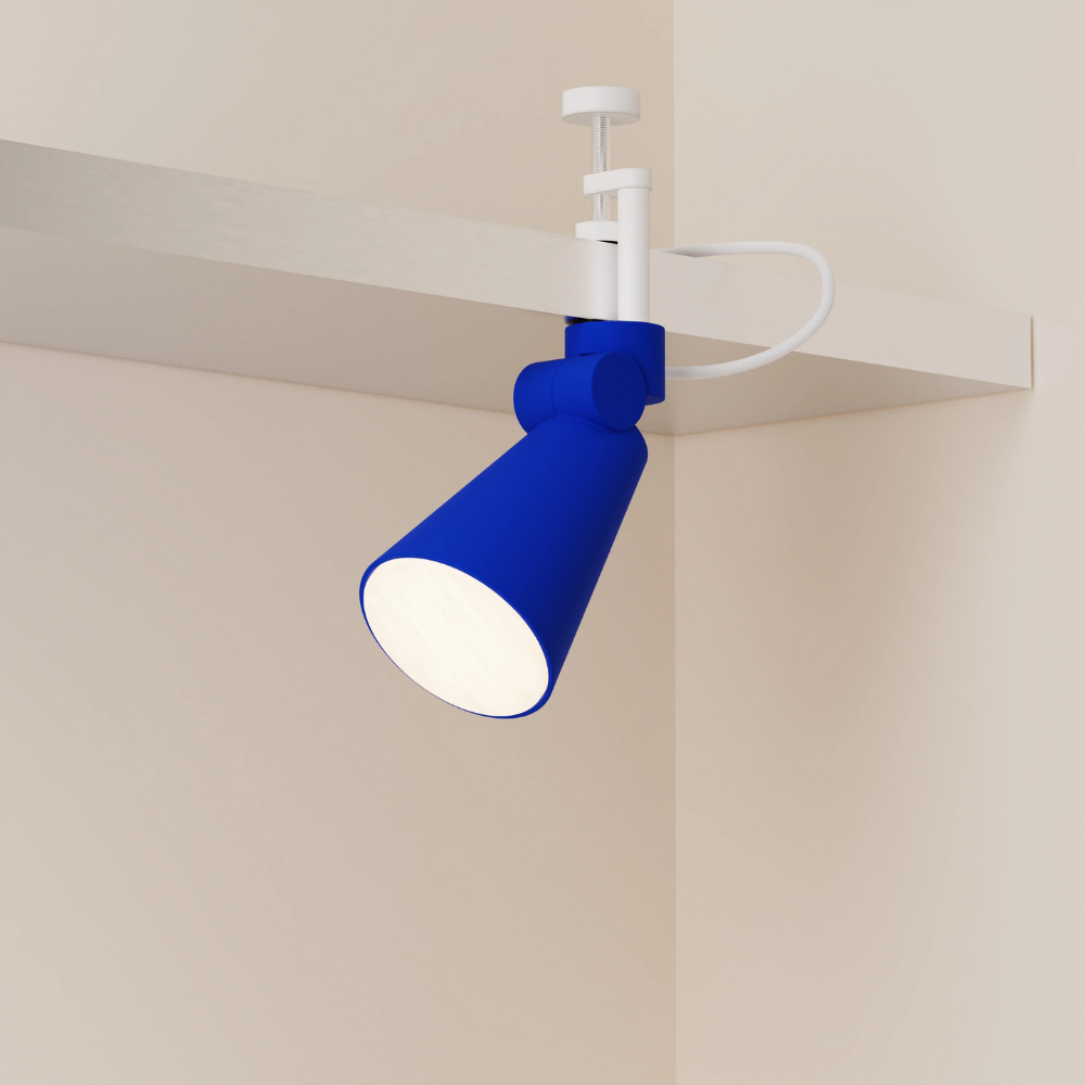 The cobalt Aim Clamp Light from Gantri with the white clamp.