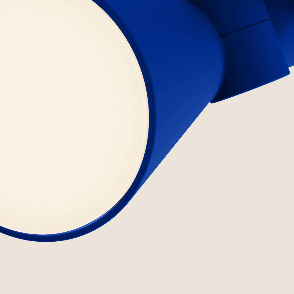 The cobalt Aim Clamp Light from Gantri close up.