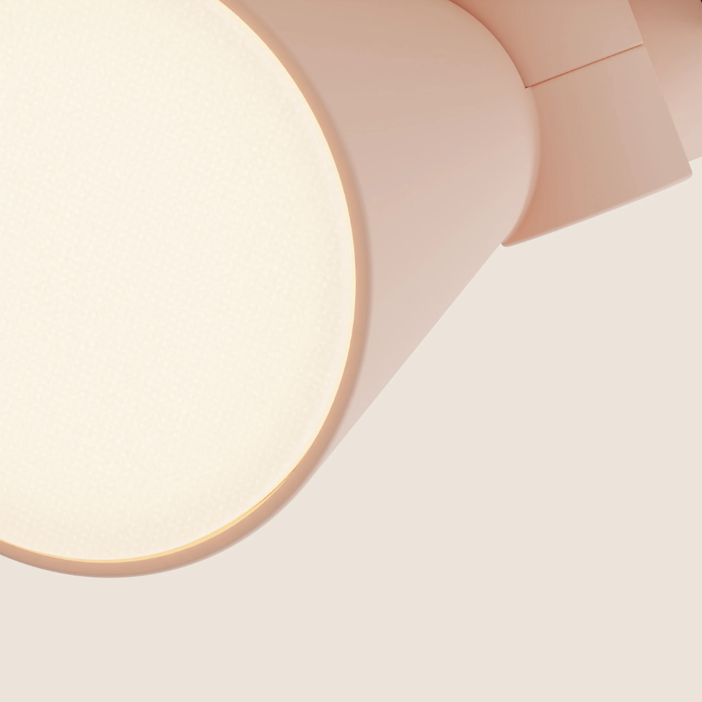 The coral Aim Clamp Light from Gantri close up.