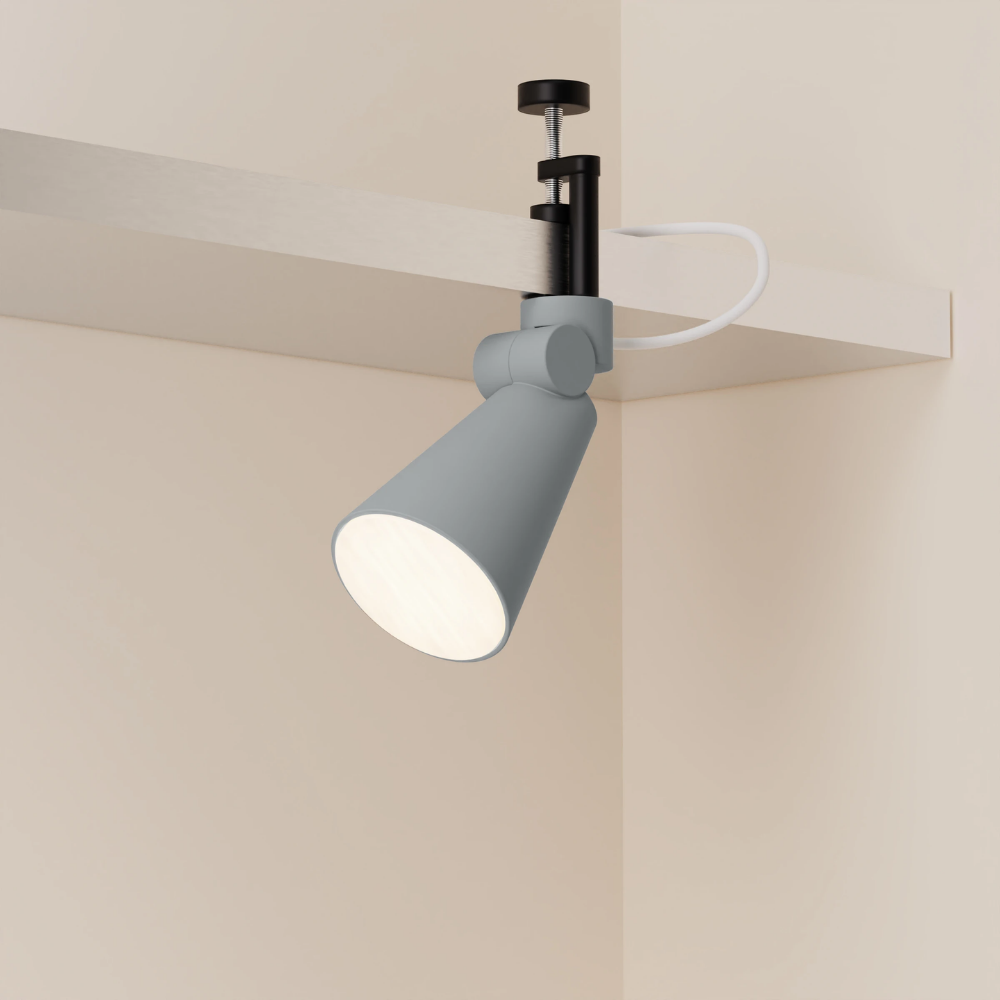 The fog Aim Clamp Light from Gantri with the black clamp.