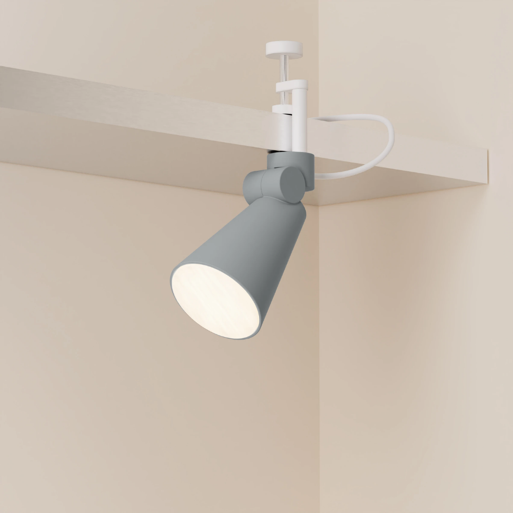 The fog Aim Clamp Light from Gantri with the white clamp.