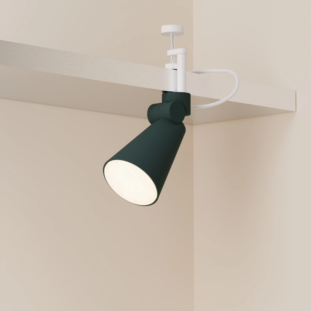 The forest Aim Clamp Light from Gantri with the white clamp.