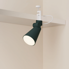 The forest Aim Clamp Light from Gantri with the white clamp.