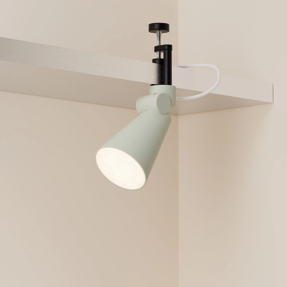 The meadow Aim Clamp Light from Gantri with the black clamp.
