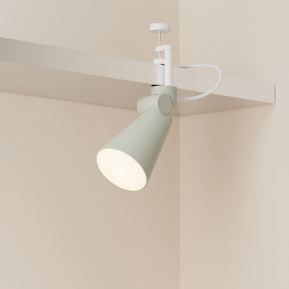 The meadow Aim Clamp Light from Gantri with the white clamp.