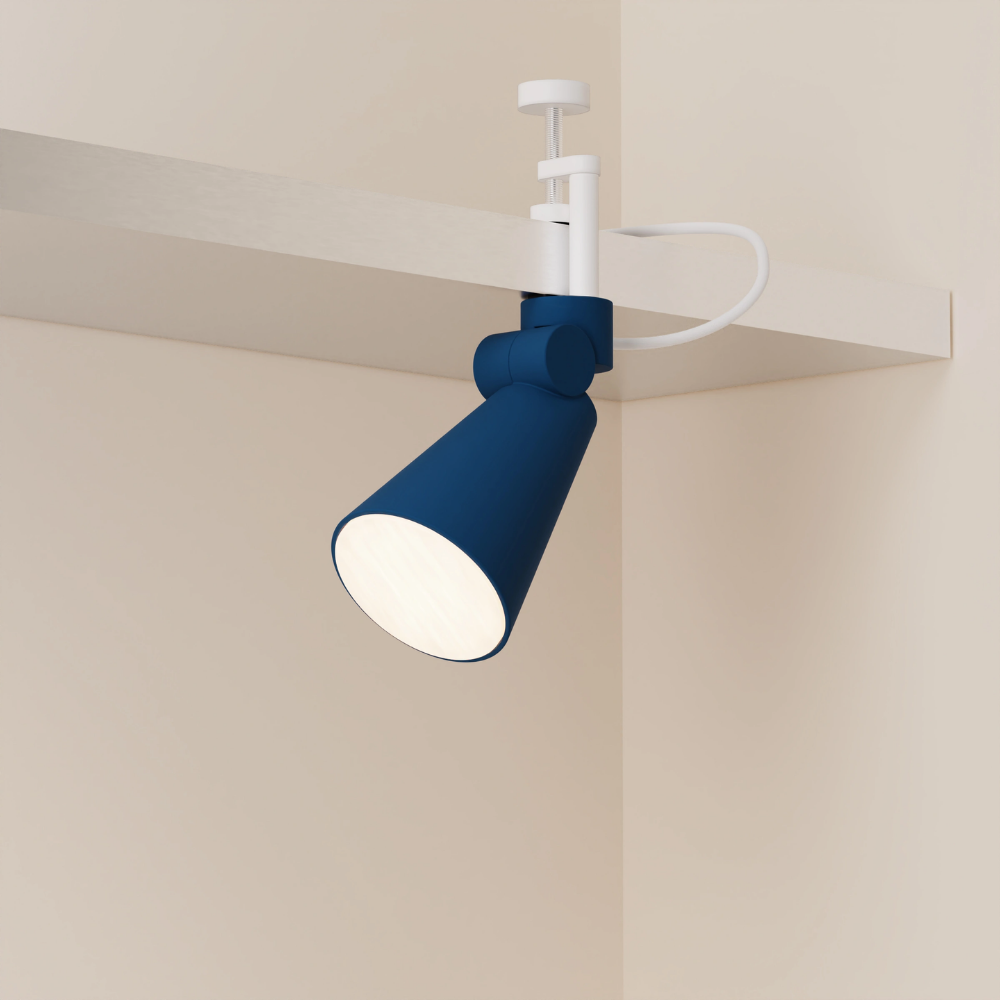 The midnight Aim Clamp Light from Gantri with the white clamp.