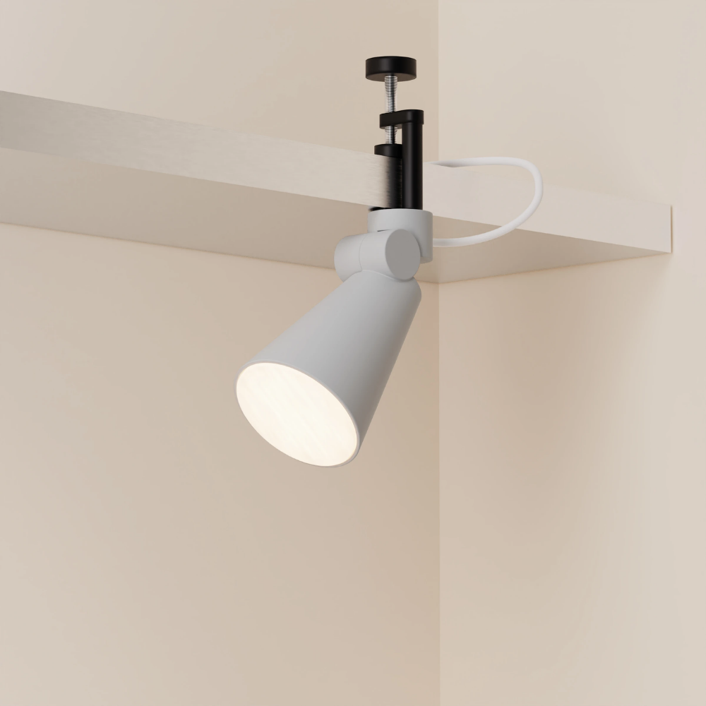 The mist Aim Clamp Light from Gantri with the black clamp.