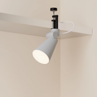 The mist Aim Clamp Light from Gantri with the black clamp.