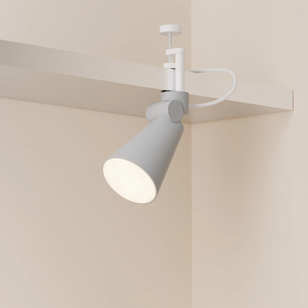The mist Aim Clamp Light from Gantri with the white clamp.