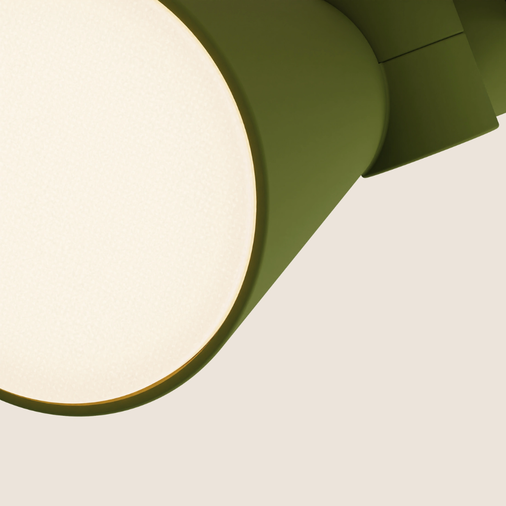 The olive Aim Clamp Light from Gantri close up.