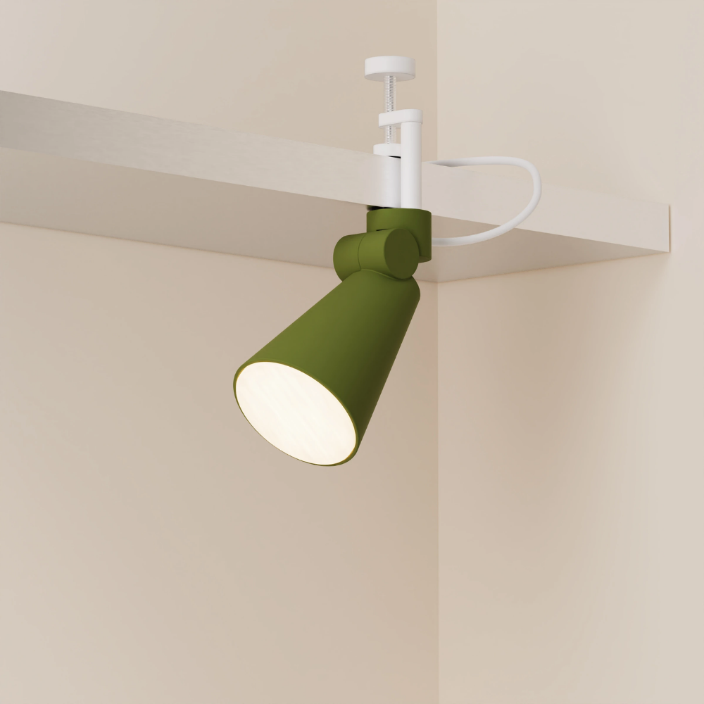 The olive Aim Clamp Light from Gantri with the white clamp.