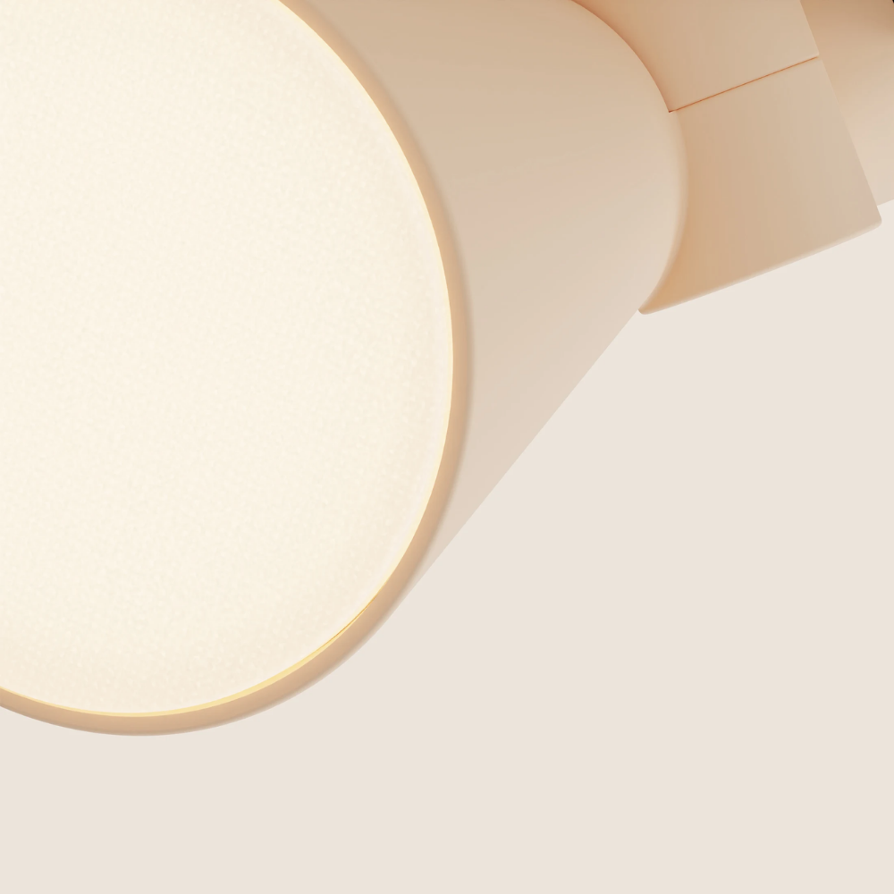The peach Aim Clamp Light from Gantri close up.