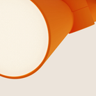 The persimmon Aim Clamp Light from Gantri close up.