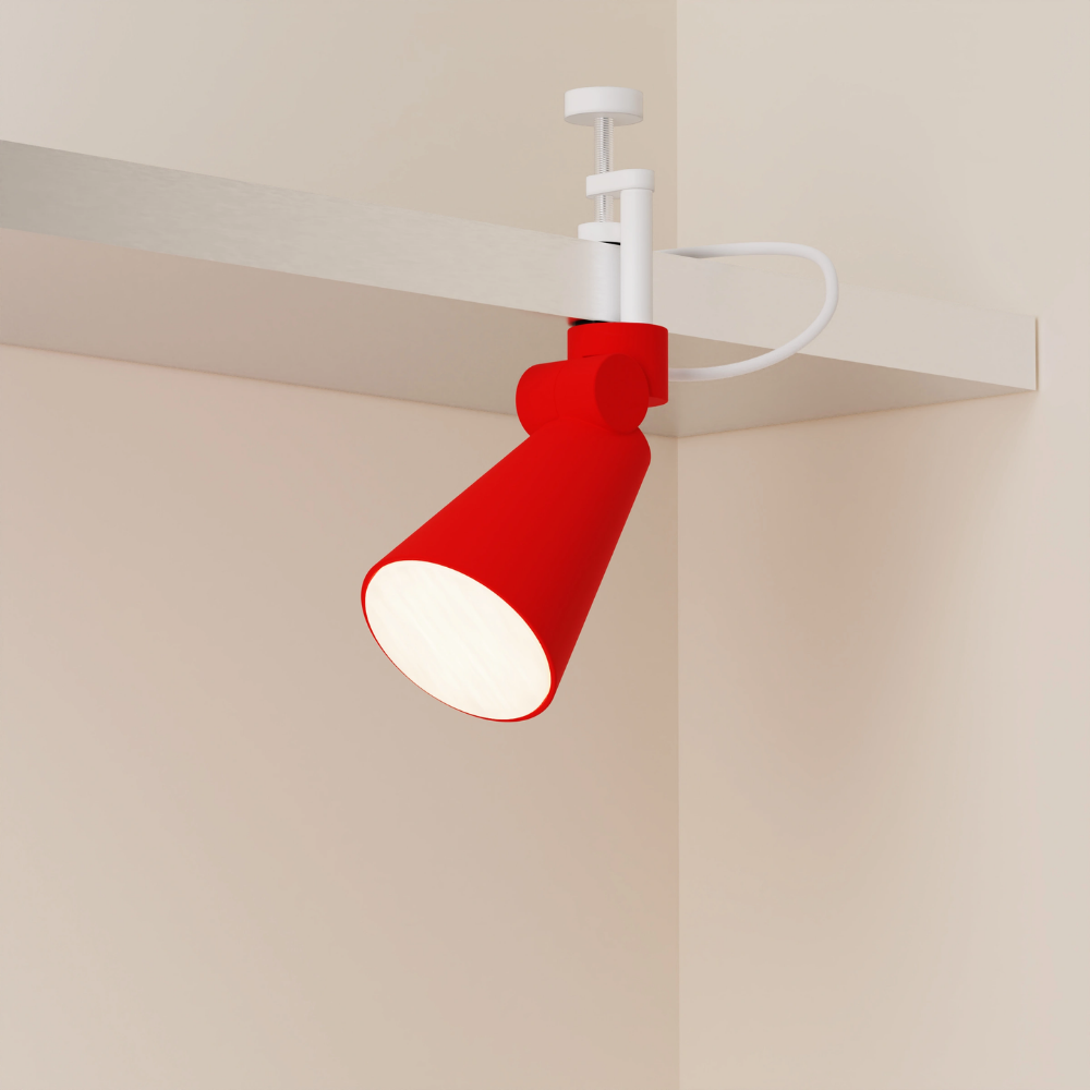 The poppy Aim Clamp Light from Gantri with the white clamp.