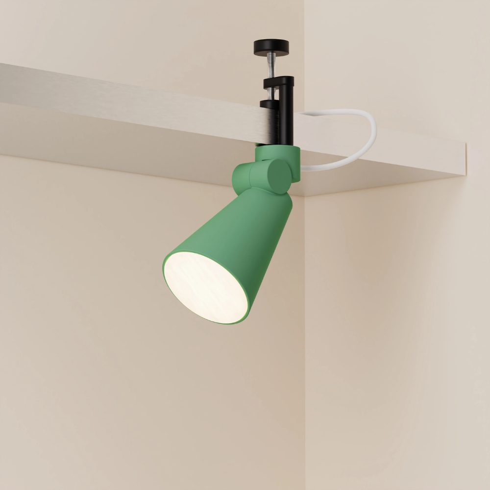 The sage Aim Clamp Light from Gantri with the black clamp.
