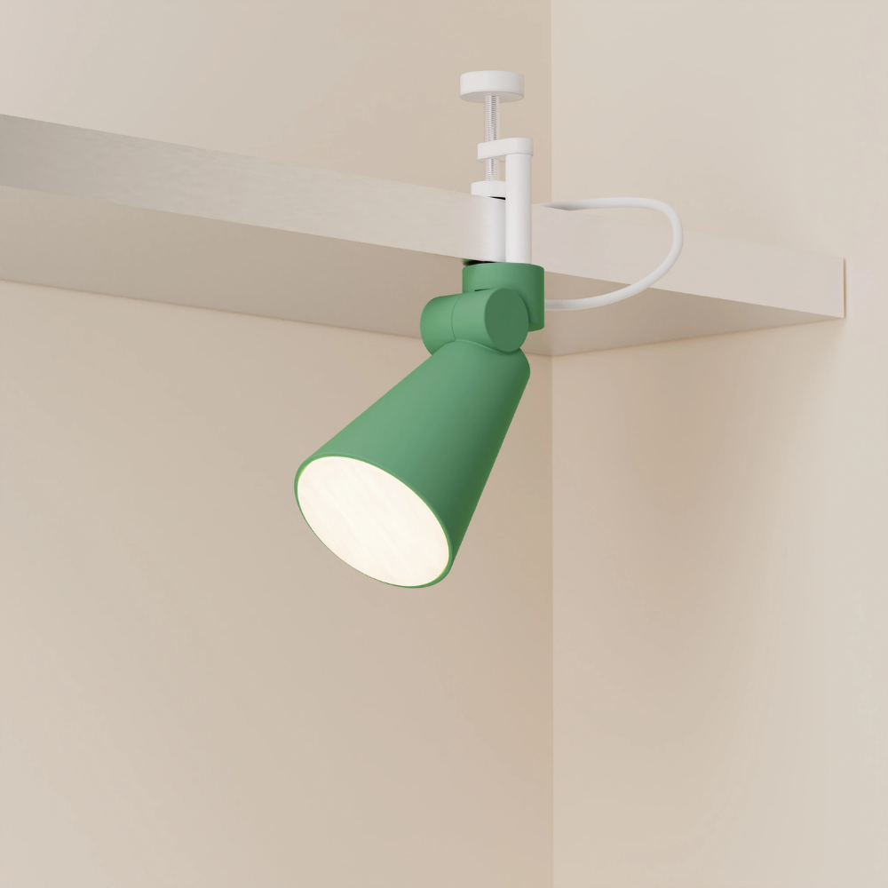 The sage Aim Clamp Light from Gantri with the white clamp.