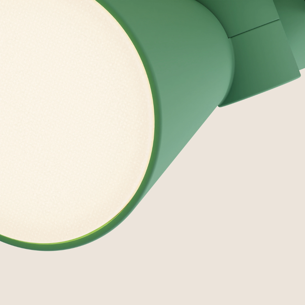 The sage Aim Clamp Light from Gantri close up.