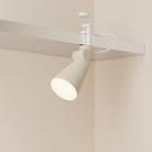 The sand Aim Clamp Light from Gantri with the white clamp.