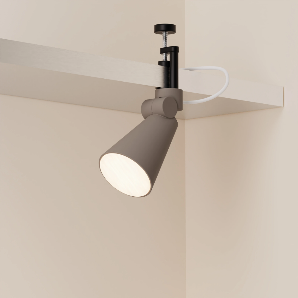 The smoke Aim Clamp Light from Gantri with the black clamp.