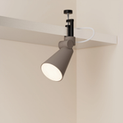 The smoke Aim Clamp Light from Gantri with the black clamp.